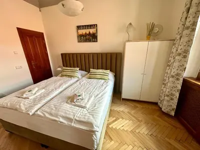 a bedroom with a bed with two shoes on it at Historic Centre Apartments VIII in Prague