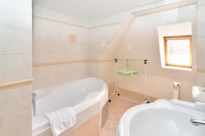 a bathroom with a tub and a sink at Historic Centre Apartments VIII in Prague