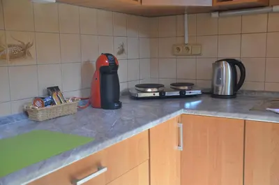 a kitchen with a counter top with a appliance on it at Apartmány Pod vodárenskou věží in Poděbrady