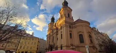 a large building with a tower on top of it at Rooftop Deluxe apartment in Prague