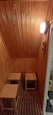 a small room with two benches in a sauna at Rooftop Deluxe apartment in Prague