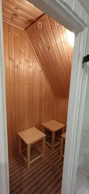 a room with two benches in a sauna at Rooftop Deluxe apartment in Prague