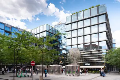 a rendering of a building with a statue in front of it at City Nest Apartments by Adrez in Prague