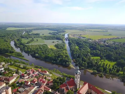 an aerial view of a town and a river at Krejčovství in Mělník