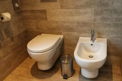 a bathroom with a toilet and a sink at Park Hotel Popovicky in Popovičky