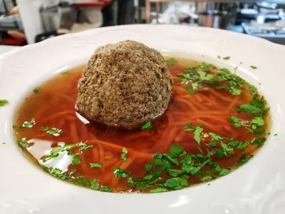 a plate of food with a meat ball on top at Park Hotel Popovicky in Popovičky