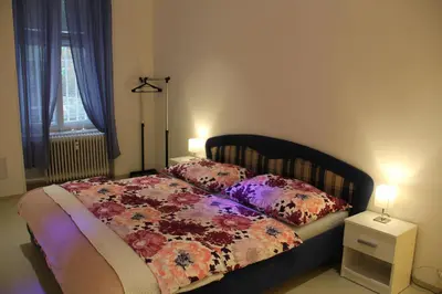 a bedroom with a bed with two pillows on it at Apartment Vltava Prague in Prague