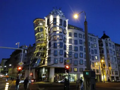 a large white building with a street light in front of it at Apartment Vltava Prague in Prague