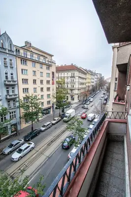 a view of a city street with cars parked at Pastel Art Deco 3BDR Ruterra Apt in Prague