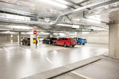 a parking garage with cars parked in it at Apartment Invalidovna with FREE parking in Prague