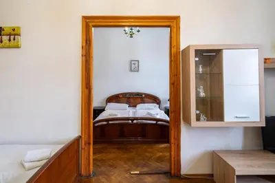 a mirror reflection of a bedroom with a bed in a room at Downtown Apartments in Prague