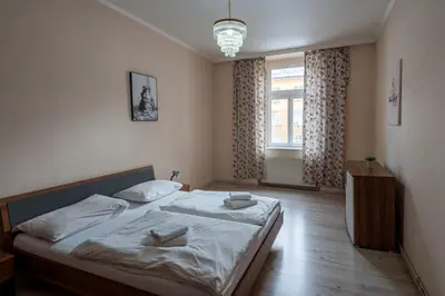 a bedroom with a bed and a window at Downtown Apartments in Prague