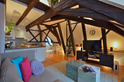 a living room with a couch and a flat screen tv at Ericsson Palace in Prague