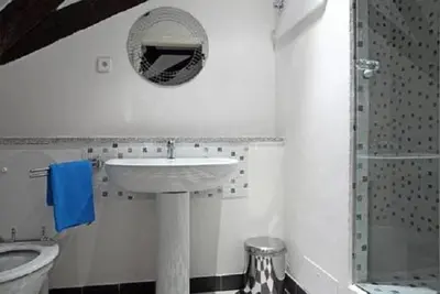 a bathroom with a sink and a toilet and a mirror at Ericsson Palace in Prague