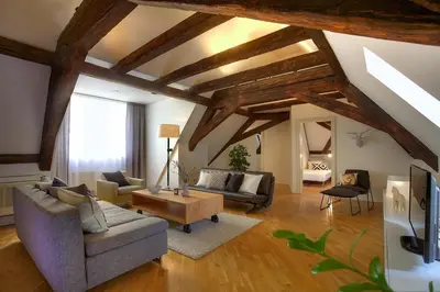 a living room with a couch and a table at Ericsson Palace in Prague