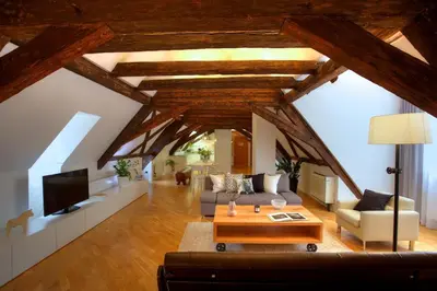 a living room with a couch and a table at Ericsson Palace in Prague