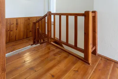 a wooden staircase in a room with wooden floors at Villa Lhota in Lhota