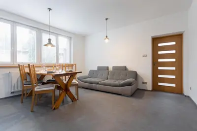 a living room with a table and a couch at Villa Lhota in Lhota