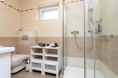 a bathroom with a shower and a sink at Villa Lhota in Lhota