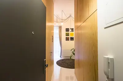 a hallway with a door leading into a room at Ruterra Studio with Private Terrace in Prague