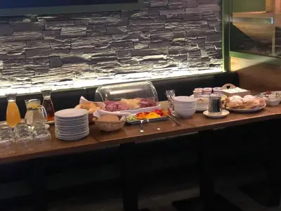 a table with plates of food on top at Exclusive Pension Vista Mlada Boleslav in Bradlec