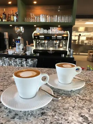 two cups of coffee sitting on a counter at Exclusive Pension Vista Mlada Boleslav in Bradlec
