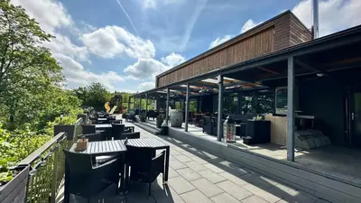 a row of tables and chairs outside of a building at Exclusive Pension Vista Mlada Boleslav in Bradlec