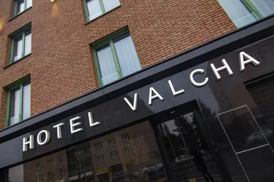 a parking garage with a car parked in it at Hotel Valcha in Prague