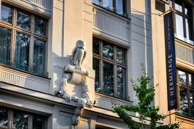a statue on the side of a building at Hermitage Hotel Prague in Prague
