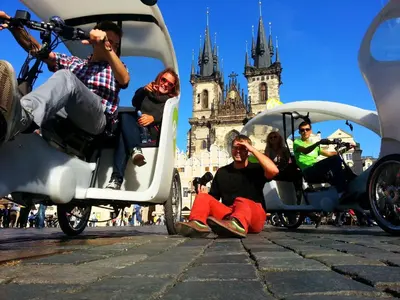 a group of people riding in a carriage in front of a castle at Best Spot Hostel in Prague