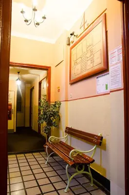 a hallway with a bench in a building at Best Spot Hostel in Prague