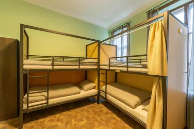 a room with four bunk beds in it at Best Spot Hostel in Prague