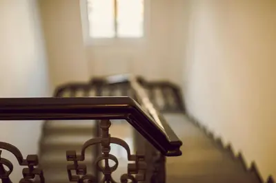 a group of stairs in a room with a window at Kings Residence in Prague