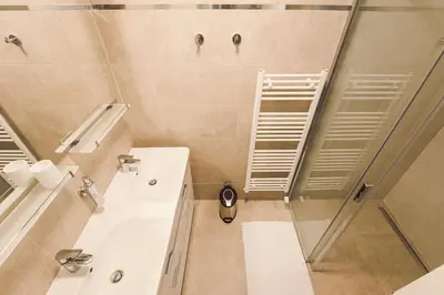 a bathroom with a shower and a sink at Kings Residence in Prague