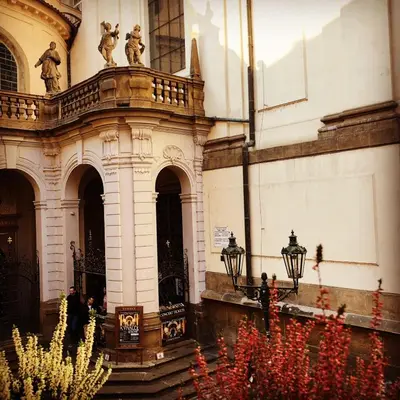 a building with a bunch of plants in front of it at Royal Road Residence II in Prague