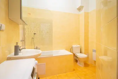 a bathroom with a sink and a toilet at Royal Road Residence II in Prague