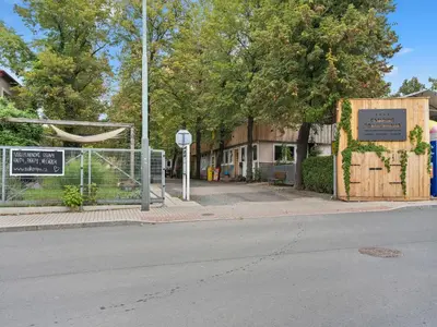 an empty street with a gate and a sign on the street at Holiday Home Sunset Terrace by Interhome in Prague