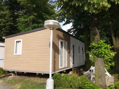 a small house with a street light in front of it at Holiday Home Hawaii Style by Interhome in Prague
