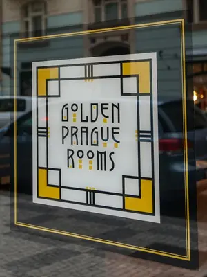 a sign in the window of a store at Golden Prague Rooms in Prague