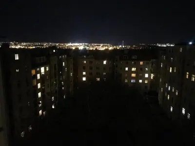 a view of a city at night with lights at Cosy Flora Nest in Prague