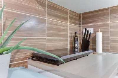 a table in a room with a wall at Apartment Alex in Prague
