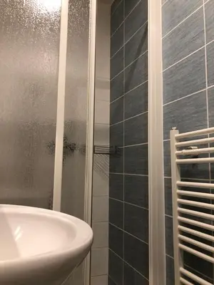 a bathroom with a sink and a shower at Welcome Hostel & Apartments Praguecentre in Prague
