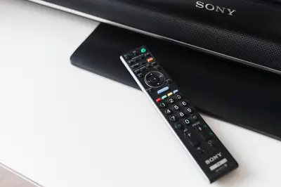 a remote control sitting on top of a computer monitor at Prague Days - Spacious Retro-vibes Apartment near Charles Square in Prague