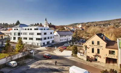 an aerial view of a small town with buildings and cars at Penzion Al Capone Mníšek in Mníšek pod Brdy