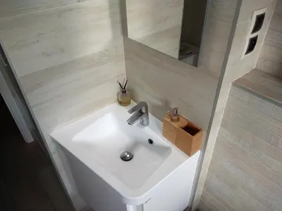a bathroom with a white sink and a mirror at Garden studio apt-FREE parking,close D8,metro,EXPO in Hovorčovice