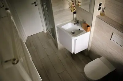 a bathroom with a white sink and a toilet at Garden studio apt-FREE parking,close D8,metro,EXPO in Hovorčovice