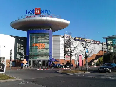 a building with a sign on top of it at Garden studio apt-FREE parking,close D8,metro,EXPO in Hovorčovice