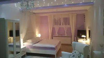 a bedroom with a bed with a canopy at Excellent Romantic in Prague