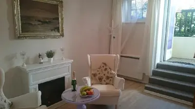 a living room with a chair and a fireplace at Excellent Romantic in Prague