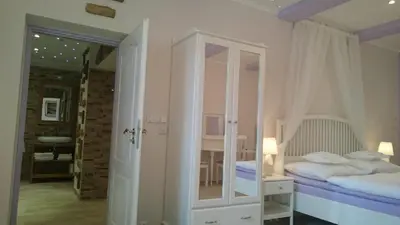 a small bedroom with a bed and a mirror at Excellent Romantic in Prague
